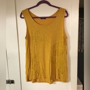 Woman’s yellow tank top